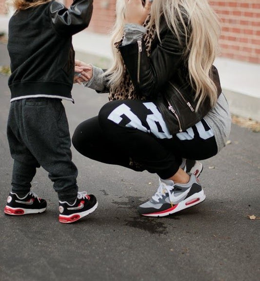 Mother daughter matching sneakers.
