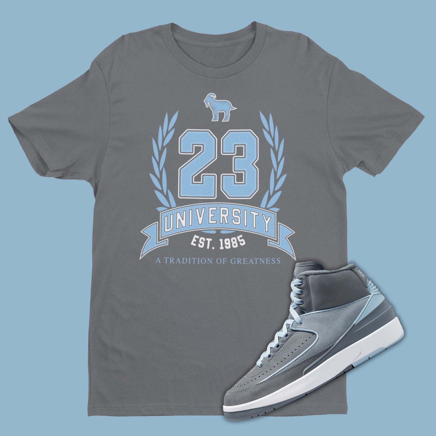 Grey t-shirt featuring a graphic of 23 University Crest with Goat emoji, designed to complement the sleek and stylish Air Jordan 2 Cool Grey sneakers