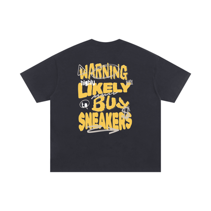 Black t-shirt with yellow text on a white background