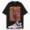 A black graphic t-shirt featuring a large vintage-style basketball poster print with the word 'GOAT' and Michael Jordan, paired with a white, pink, and black Air Jordan 4 Comic sneaker shown in front.