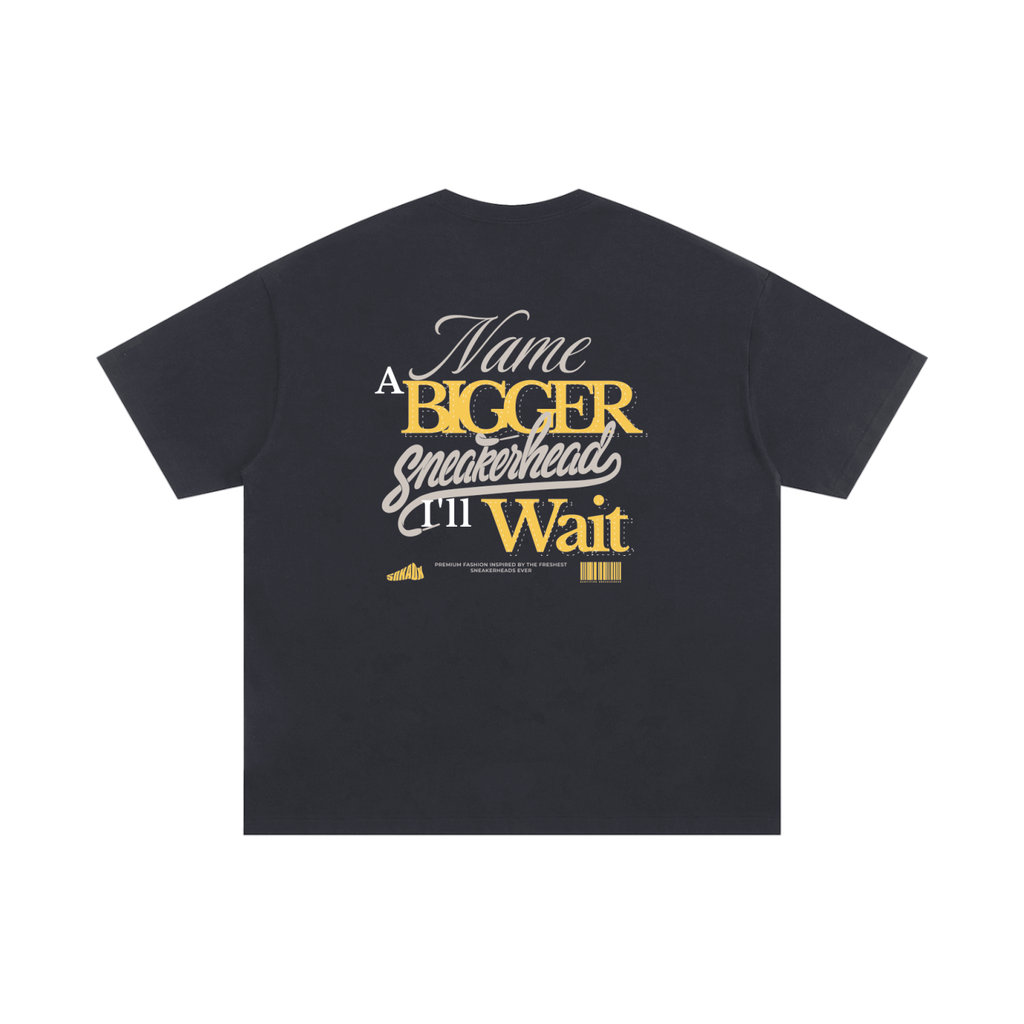 Black t-shirt with yellow text on a white background