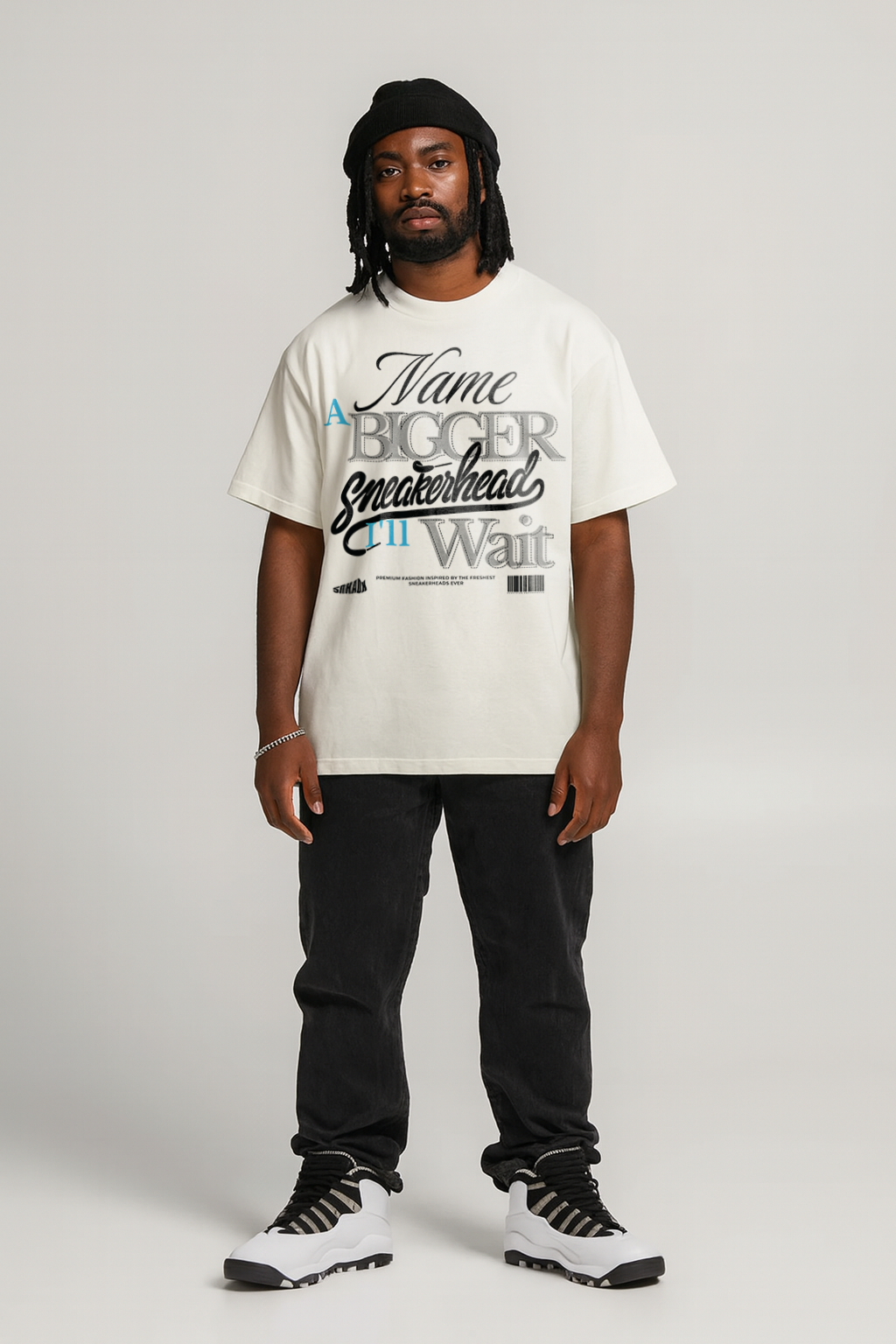 Person wearing a white t-shirt to match Air Jordan 10 Steel with text and black pants on a plain background