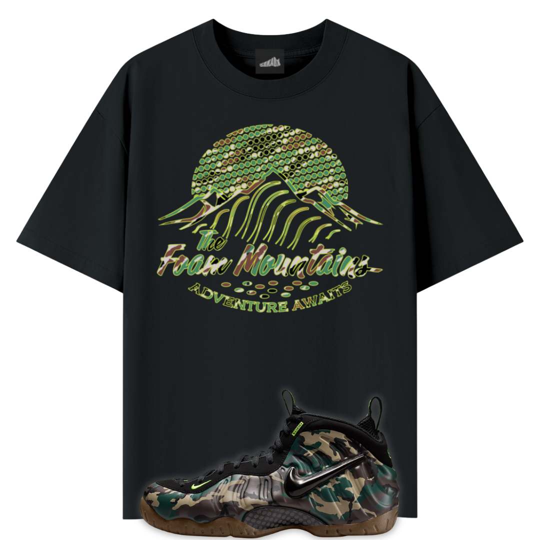 Back tee with image of mountains in a camouflage print and a Nike Air Foamposite Pro Camo sneakers in the front