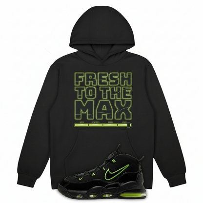 Black hoodie with 'Fresh to the Max' text and Air Max Uptempo 95 Black Volt 2025 sneakers with green accents on a bright green background