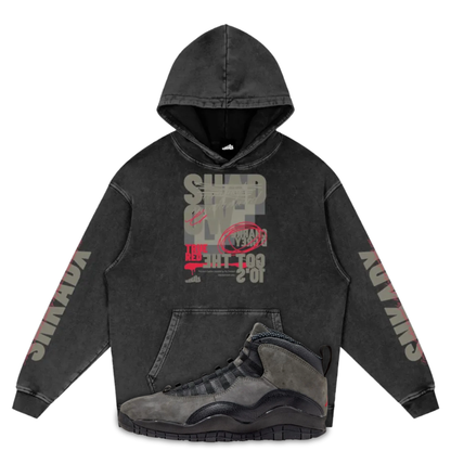 Black hoodie with graphic design and Air Jordan 10 Shadow on a white background