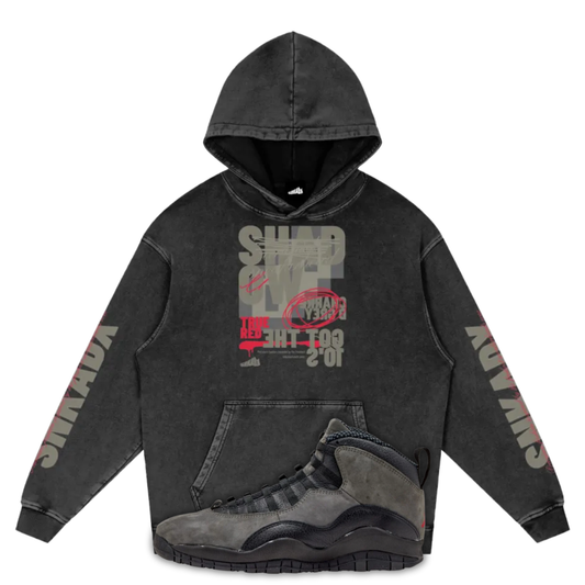 Black hoodie with graphic design and Air Jordan 10 Shadow on a white background
