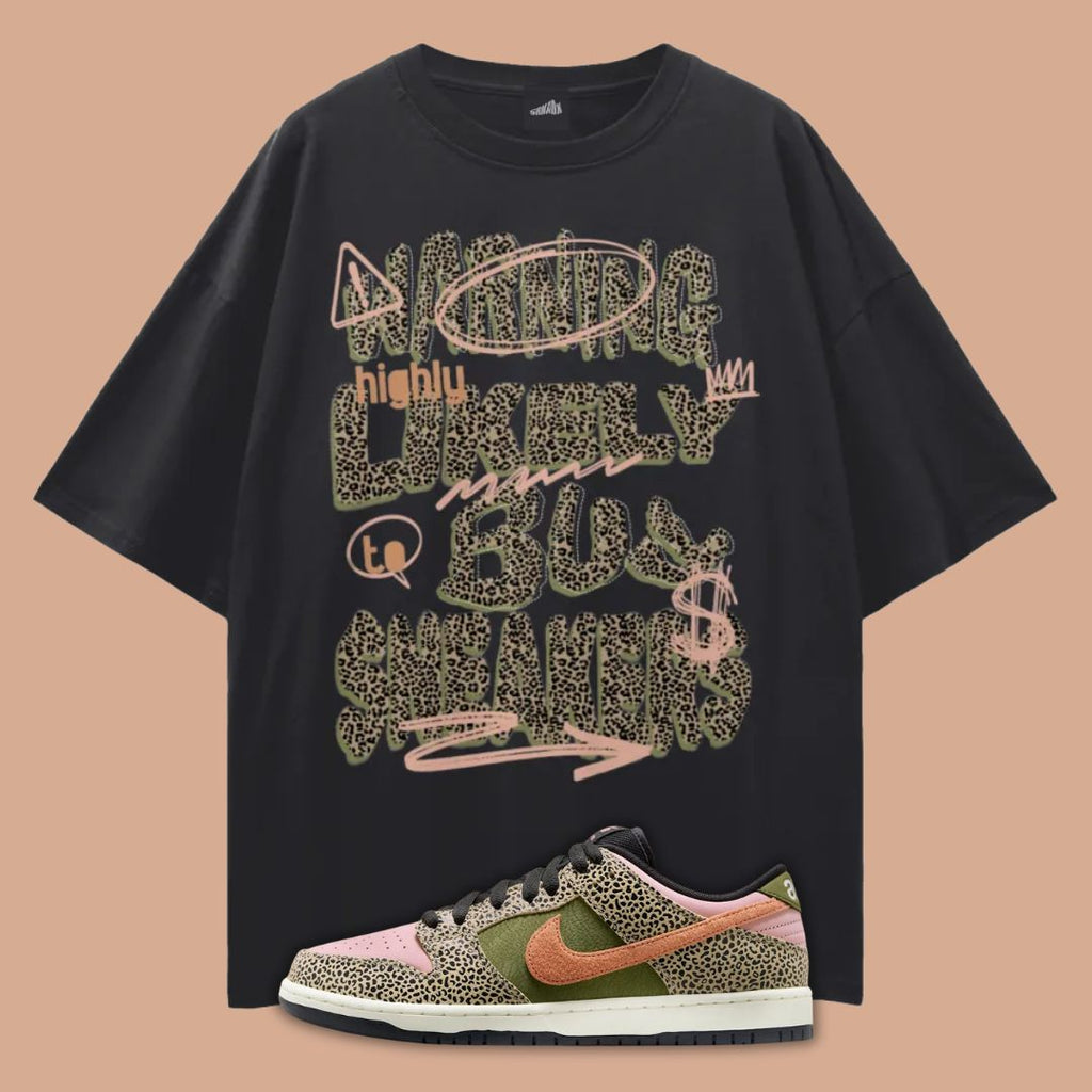 Black oversized t-shirt with colorful text design and a Nike Arts & Rec Dunks on a beige background