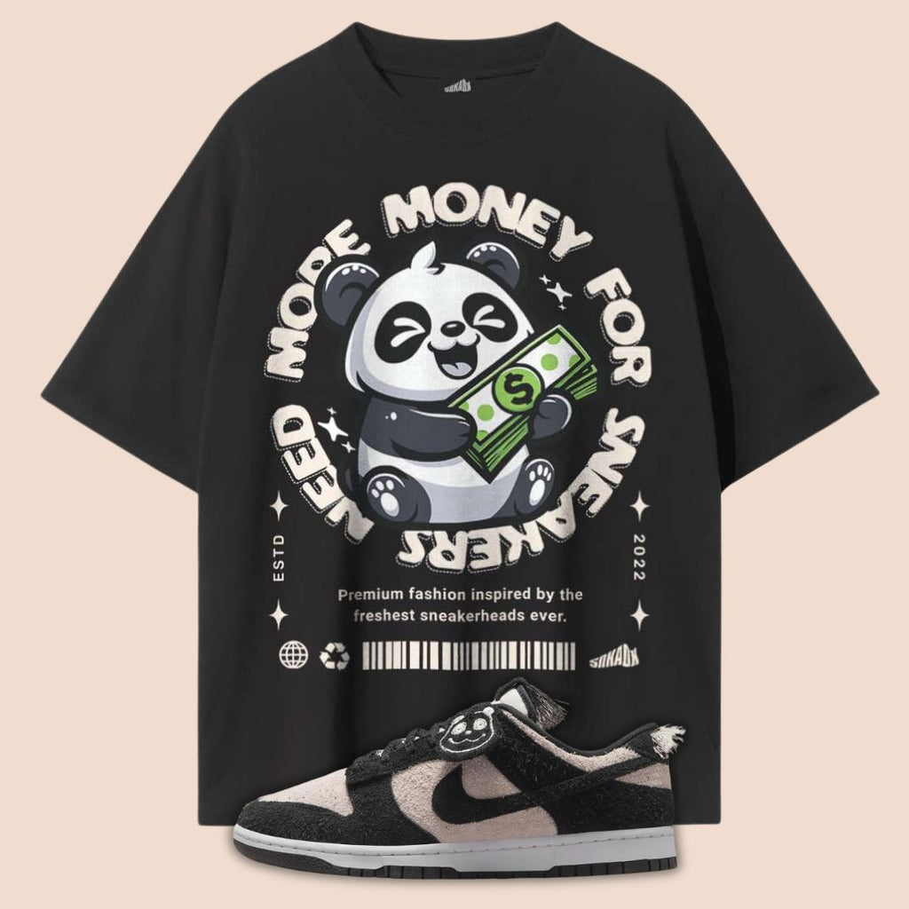 Black t-shirt with a panda graphic and text on a beige background matches nike dunk low panda white black