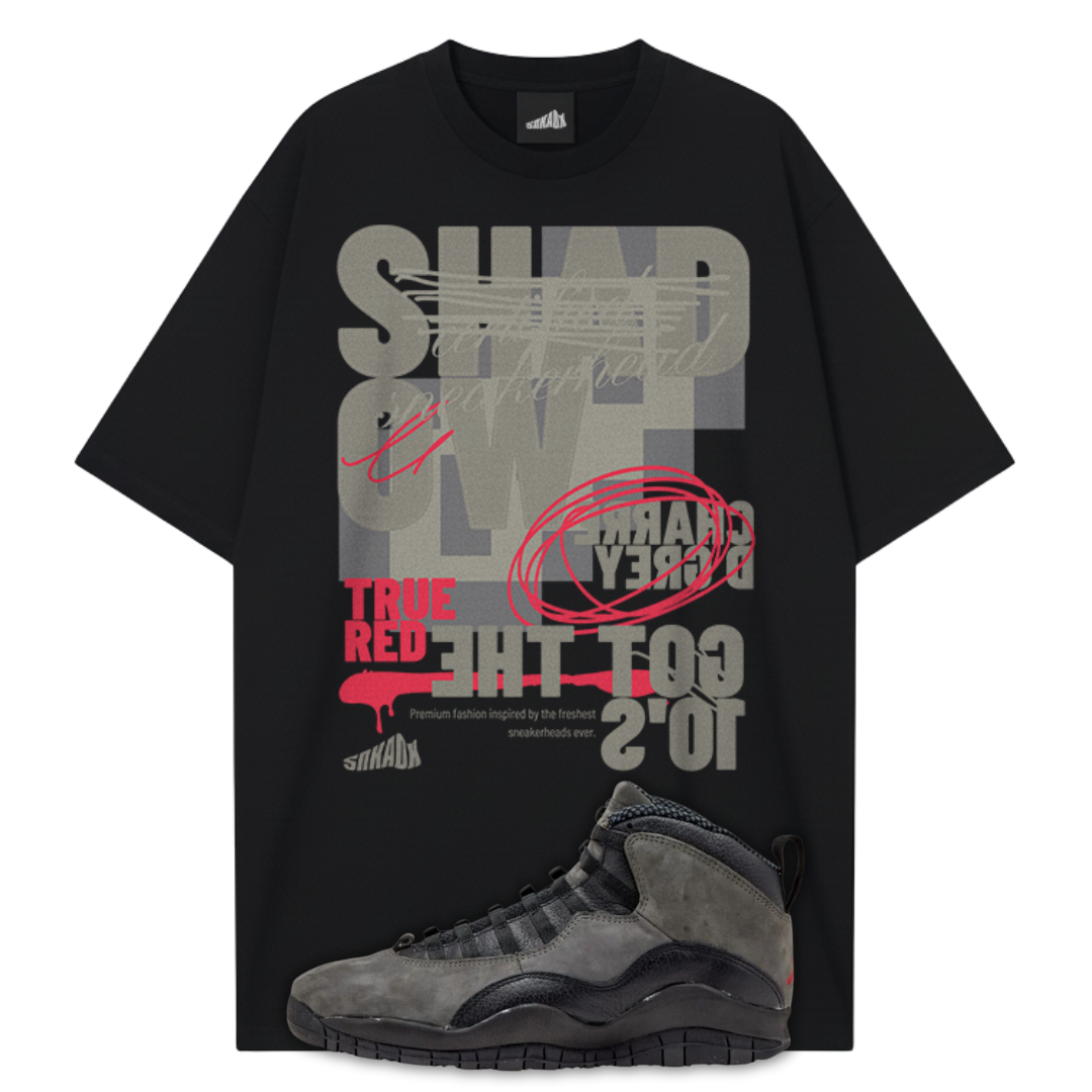 Black t-shirt with graphic design and a Jordan 10 Shadow sneaker on a white background