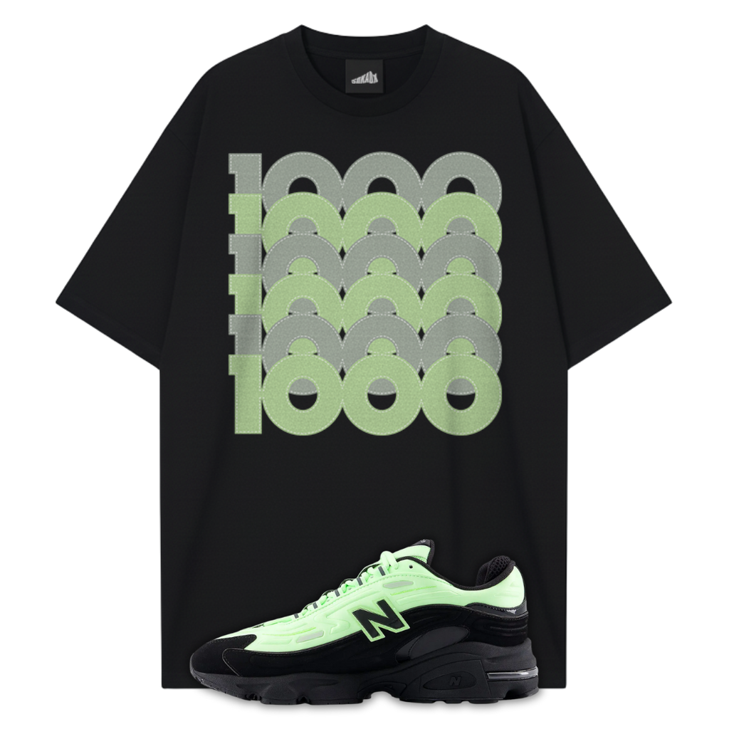 Black t-shirt with green and gray graphic design and a matching New Balance 1000 Black Neon Green sneakers on a white background