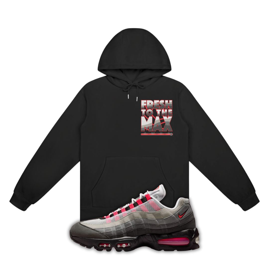 Black hoodie with 'Fresh to the Max' text and Nike Air Max 95 Solar Red sneaker with red accents on a white background