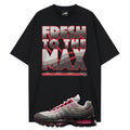 Black t-shirt with 'Fresh to the Max' graphic and a Air Max 95 Solar Red sneaker with red accents on a white background