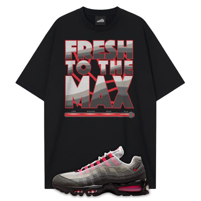 Black t-shirt with 'Fresh to the Max' graphic and a Air Max 95 Solar Red sneaker with red accents on a white background