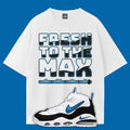White t-shirt with 'Fresh to the Max' text and a sneaker graphic on a blue background designed to make Nike Air Max Uptempo Photo Blue.