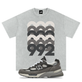 Gray t-shirt with '992' design and matching New Balance 992 Shadow Grey sneaker on a white background