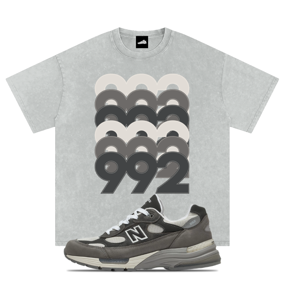 Gray t-shirt with '992' design and matching New Balance 992 Shadow Grey sneaker on a white background