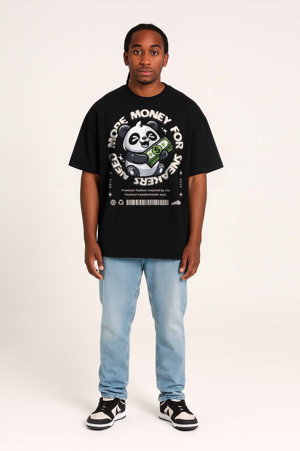 Person wearing a black t-shirt with a panda graphic and text, standing against a white background