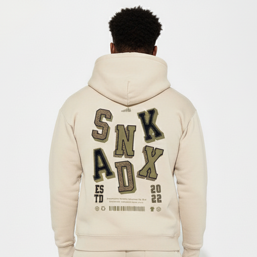 Man in SNKADX cream hoodie