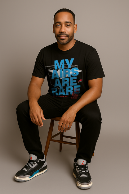 Man sitting wearing black tee designed to match Air Jordan 3 Rare Air with "My Airs are Rare" on the front.