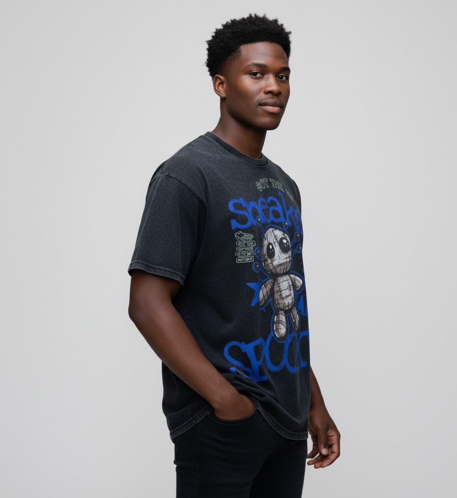 Man wearing a black t-shirt by SNKADX with graphic design and text on a plain background