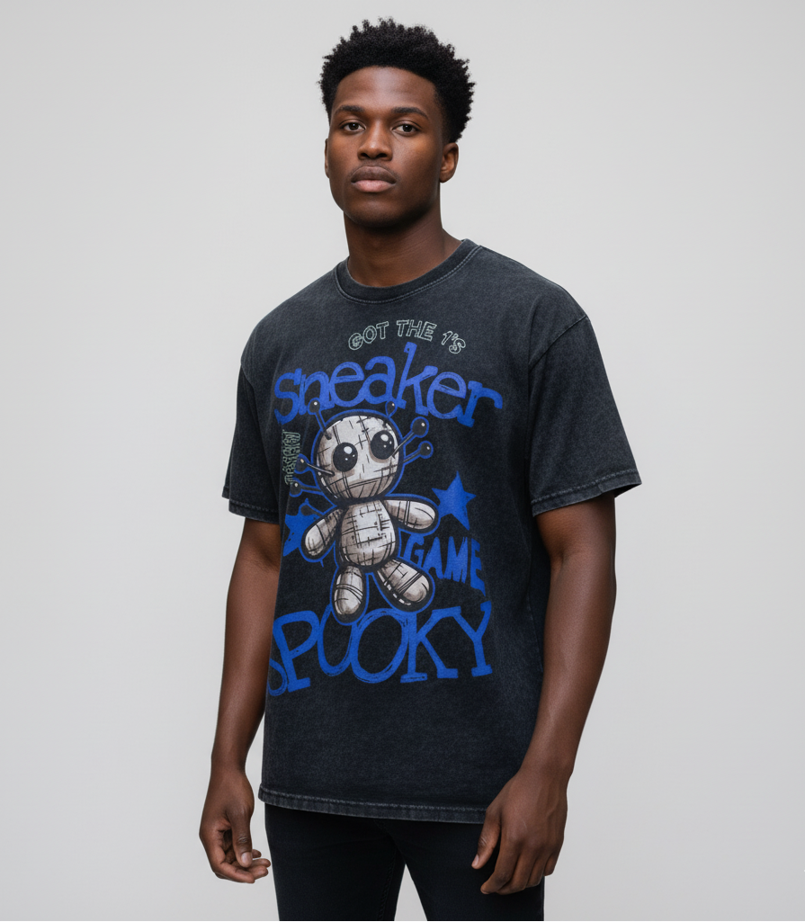 Man wearing a black t-shirt with blue graphic design and text on a plain background