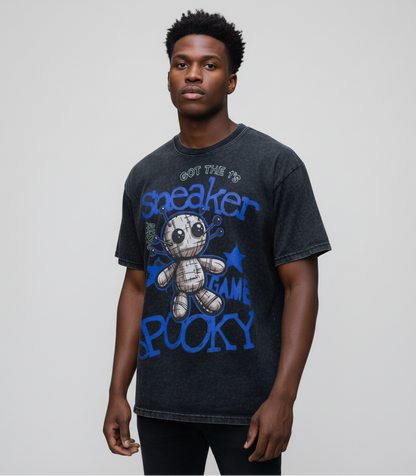 Man wearing a black t-shirt with blue graphic design and text on a plain background