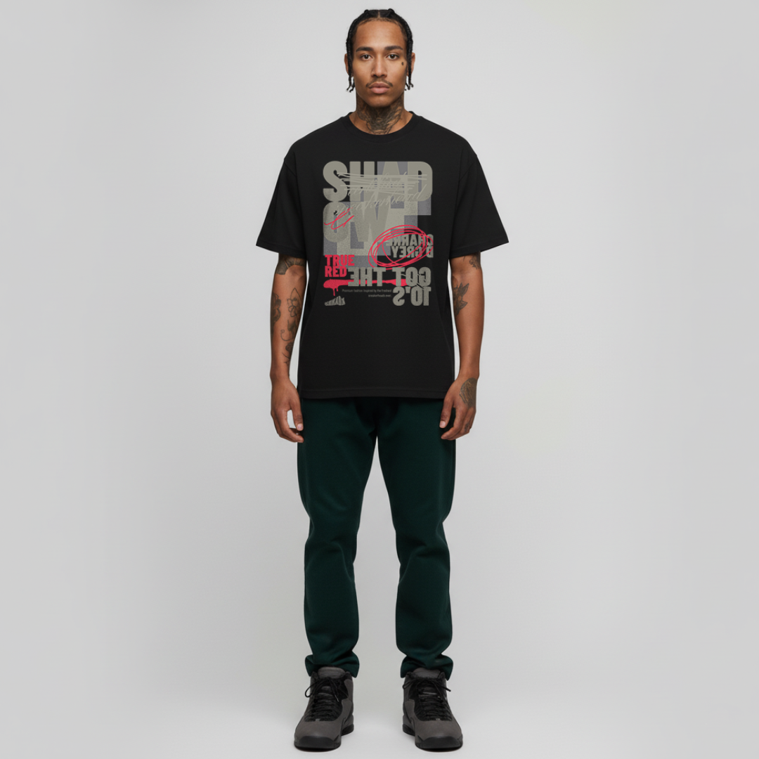 Man wearing a black t-shirt with graphic design on a plain background