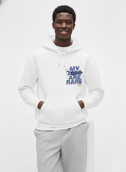 Man wearing a white hoodie with text and gray pants on a white background