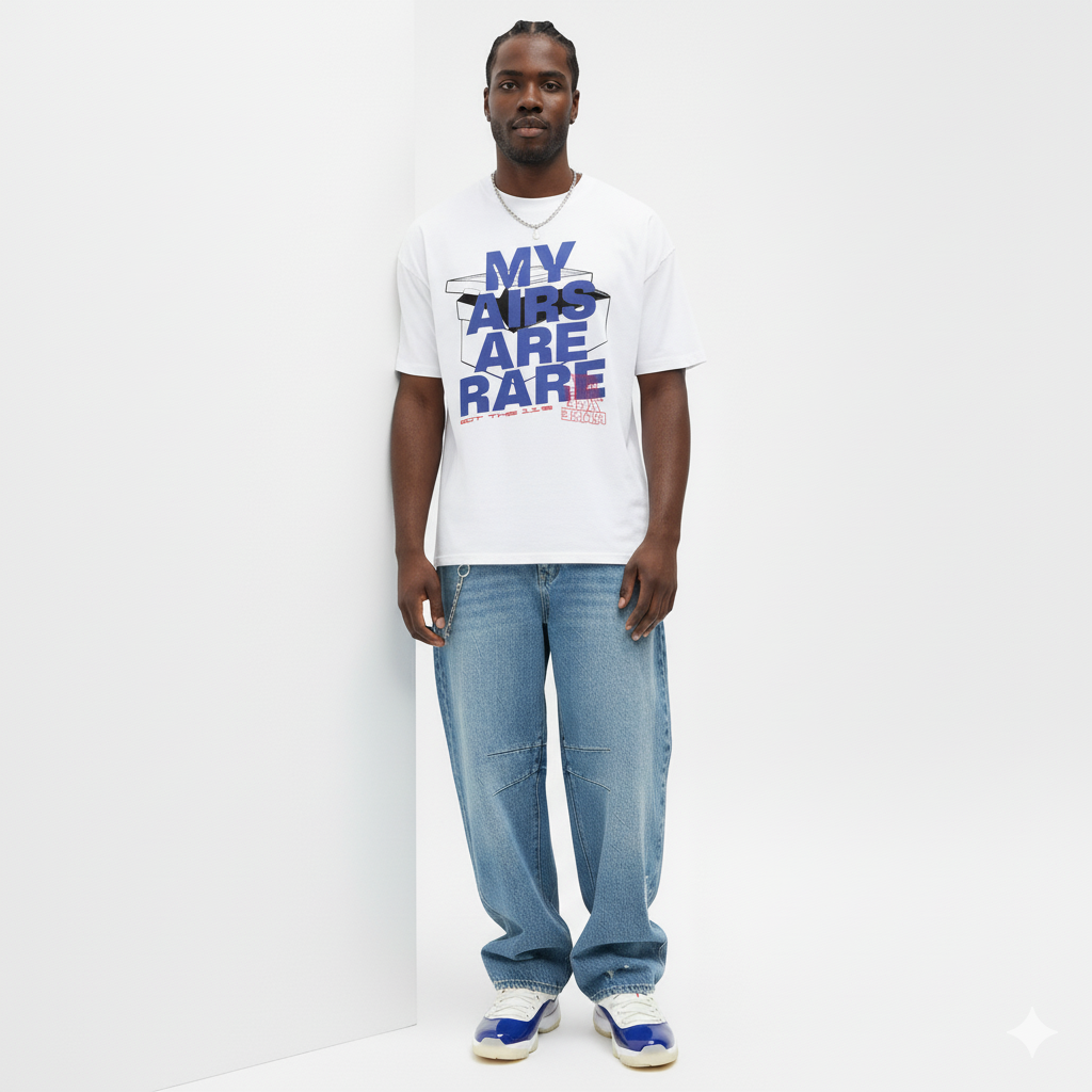 Man wearing a white t-shirt with text and blue jeans on a white background