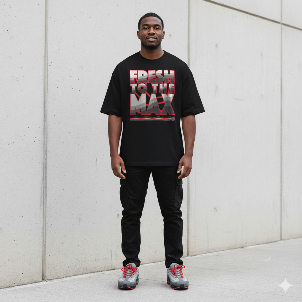 Person wearing a black t-shirt with 'Fresh to the Max' text, standing against a light gray wall.