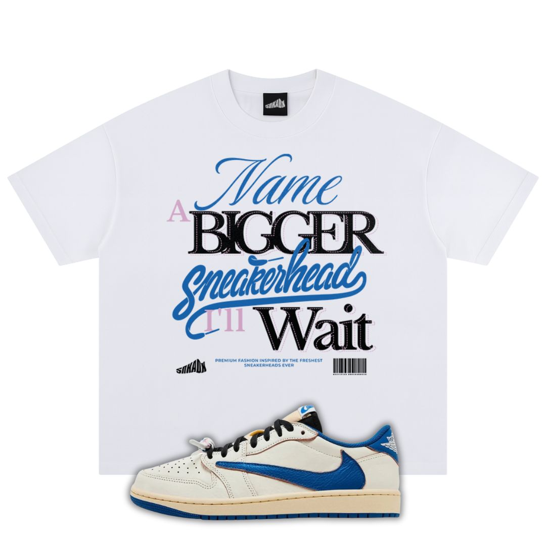 White t-shirt with graphic text and a fragment x Travis Scott x Air Jordan 1 Low White/Blue sneaker on a white background