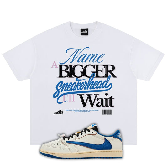 White t-shirt with graphic text and a fragment x Travis Scott x Air Jordan 1 Low White/Blue sneaker on a white background
