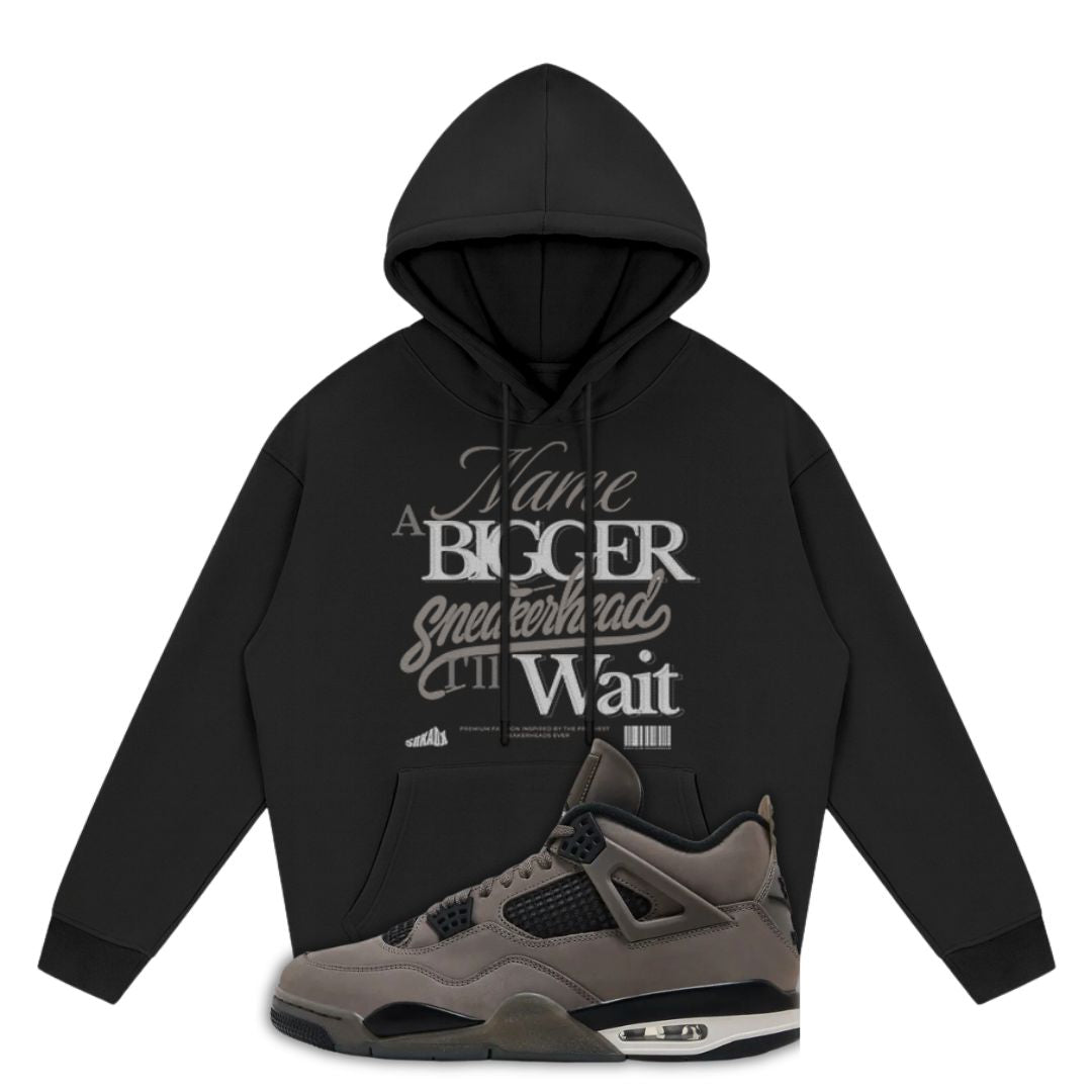 Black hoodie with white text and a gray Air Jordan 4 Cave Stone on a white background