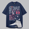 Navy blue t-shirt with Michael Jordan dunking graphic and Air Jordan 12 French Blue sneakers on a gray background.