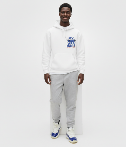Person wearing a white hoodie with text Air Jordan 11 Rare Air sneakers and gray pants on a white background