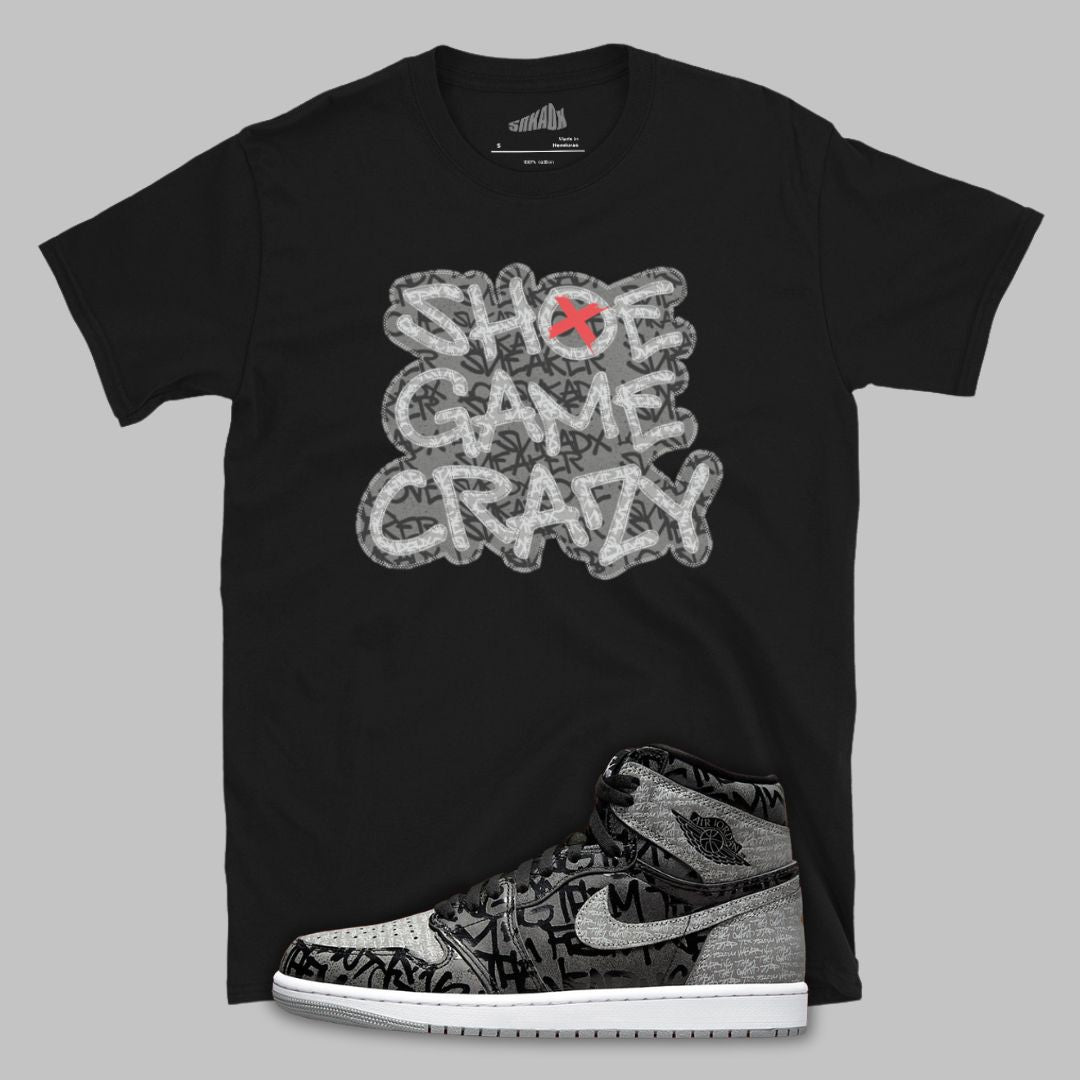 Black t-shirt with 'Shoe Game Crazy' graphic and a sneaker design on a gray background
