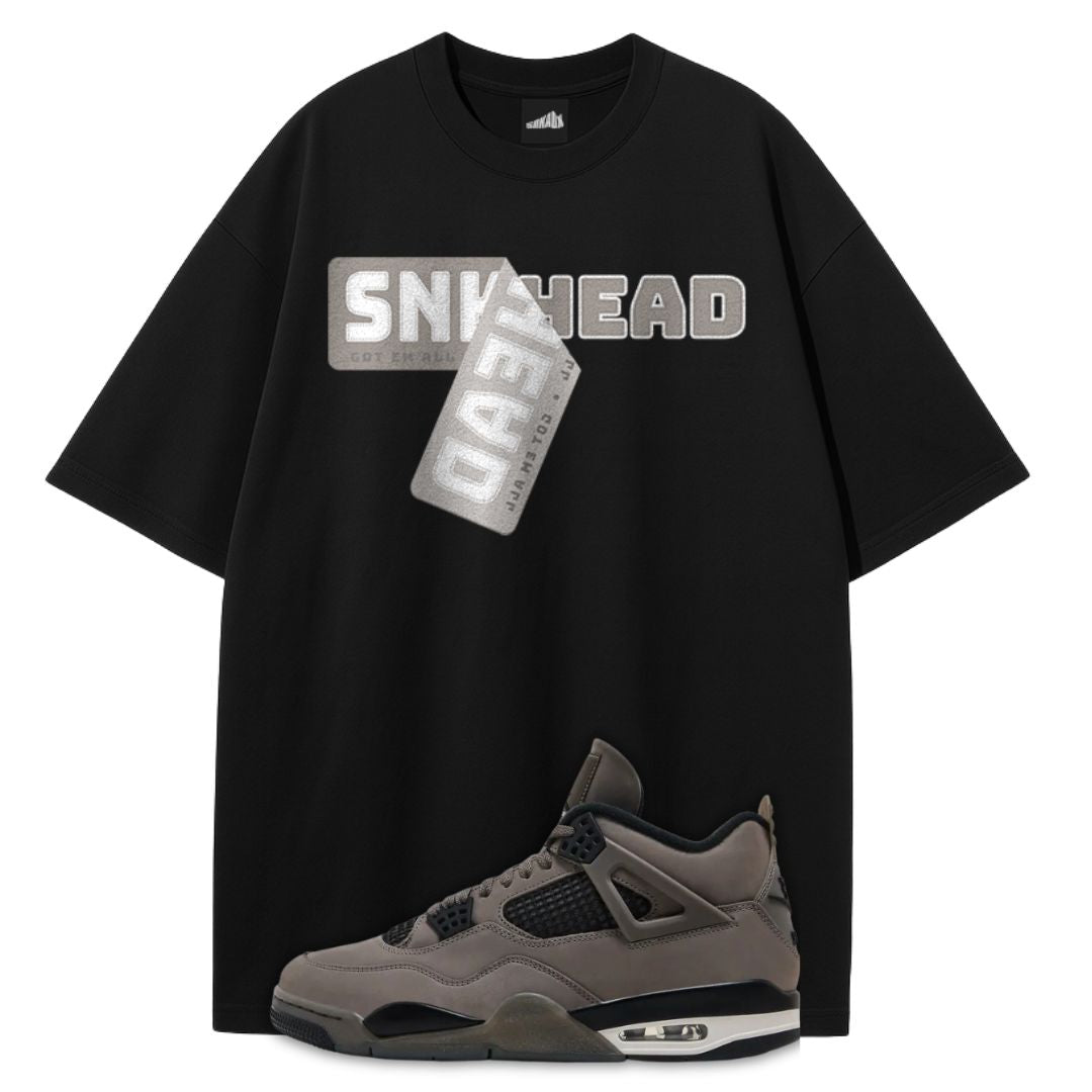 Black t-shirt with 'SNK HEAD' graphic and a Air Jordan 4 Cave Stone on a white background