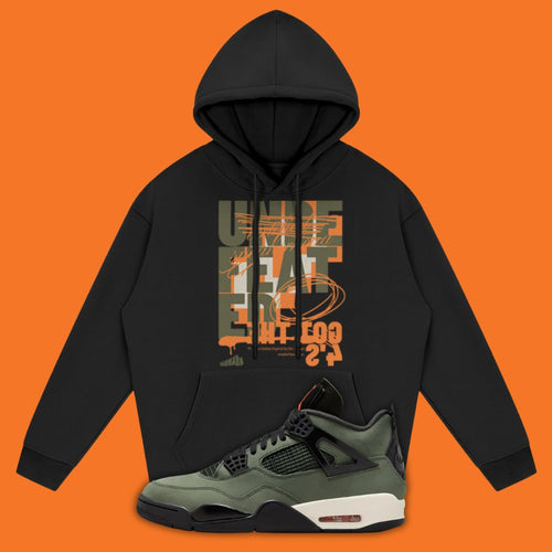 Black hoodie with graphic design and a Air Jordan 4 Undefeated sneaker on an orange background