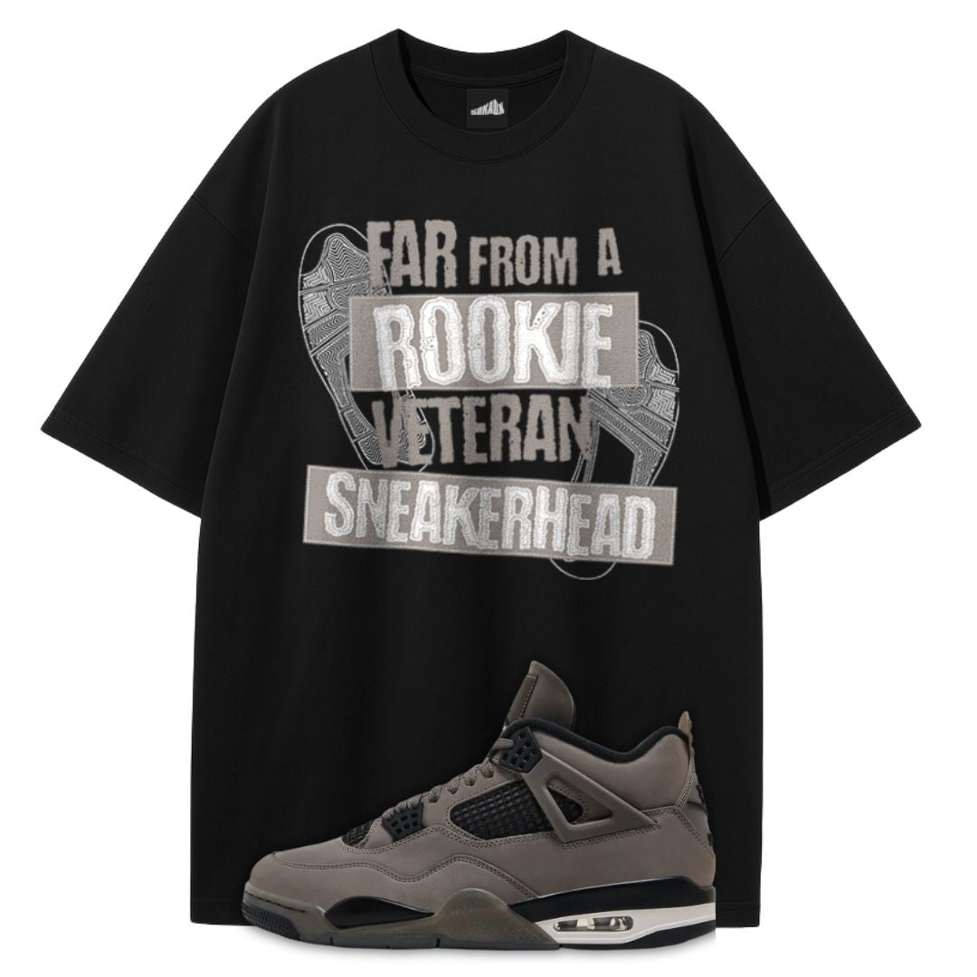 Black t-shirt with 'Rookie Veteran Sneakerhead' text and a gray sneaker on a white background