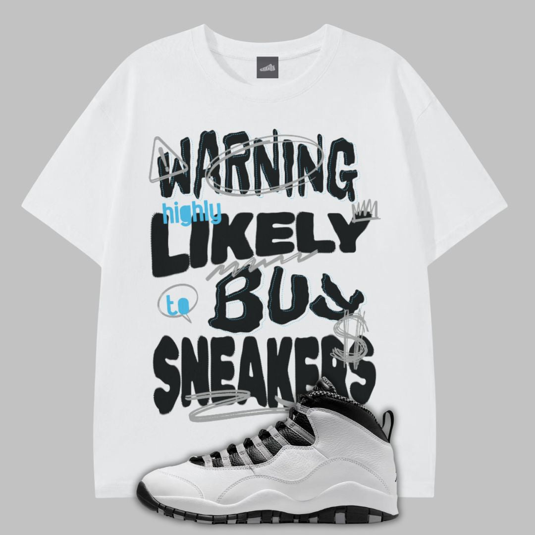 White t-shirt with Warning Highly Likely to Buy Sneakers graphic text and a sneaker on a gray background