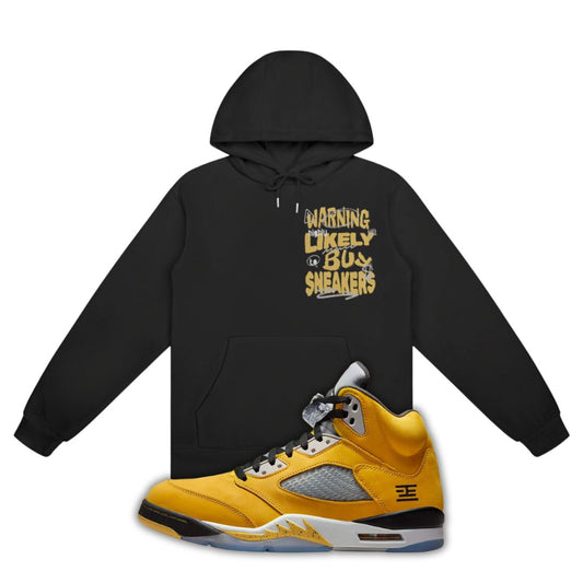 Black hoodie with yellow text and a Air Jordan 5 Tokyo 2025 sneaker on a white background