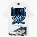 White t-shirt with 'Original Sneakerhead' graphic and blue Nike Air Diamond Turf 2 Royals sneakers on a white background