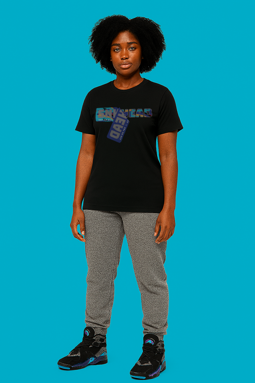 Person wearing a black t-shirt with text and graphics on a blue background
