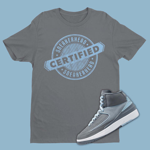 Grey t-shirt featuring a graphic of Certified Sneakerhead Stamp, designed to complement the sleek and stylish Air Jordan 2 Cool Grey sneakers