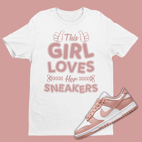 The perfect shirt to match your Nike Dunk Rose Whisper sneakers! Our Match Rose Whisper Dunks t-shirt is made to compliment your kicks. Bring your sneakers to the next level with this Dunk Rose Whisper shirt. Match and feel trendy with this graphic tee! This Girl Loves Her Sneakers on the front.