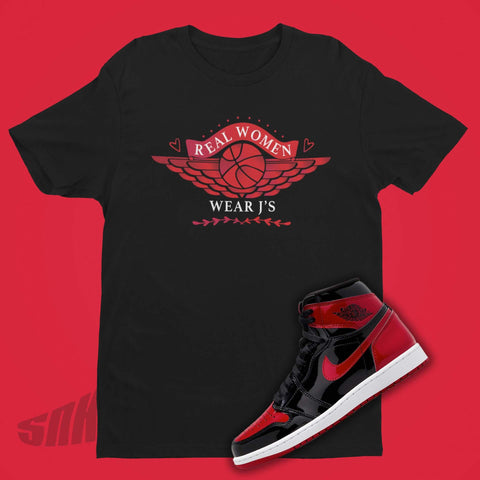 Real Women Wear J's in Red and White on Black Tee to match Jordan 1 Patent Bred